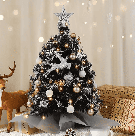 A festive mini Christmas tree adorned with ornaments and lights, perfect for adding a cozy holiday touch to small spaces or Airbnb setups.