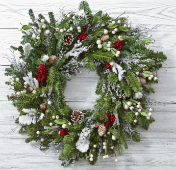 Beautiful snowflake wreath with frosted branches and silver accents, perfect for adding a touch of winter elegance to your holiday decor.