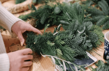 Minimal modern wreath with simple greenery and sleek design, adding an elegant and subtle festive touch to an Airbnb's Christmas decor.